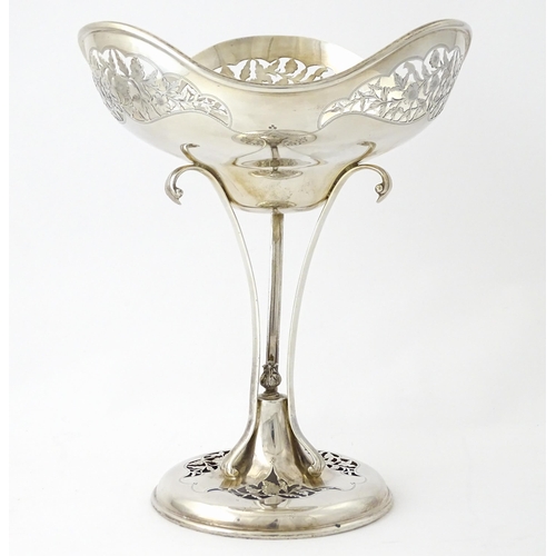 518 - A silver table centrepiece bowl of pedestal form with pierced floral and foliate decoration hallmark... 