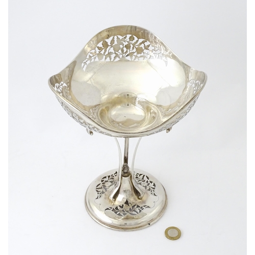 518 - A silver table centrepiece bowl of pedestal form with pierced floral and foliate decoration hallmark... 