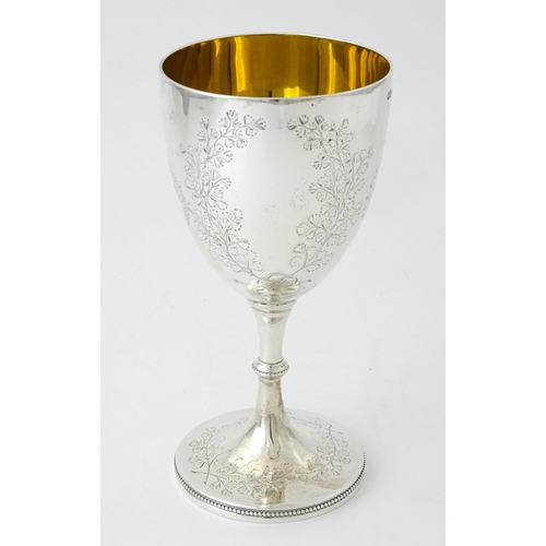 522 - A Victorian silver goblet with engraved foliate decoration and gilded interior, hallmarked London 18... 