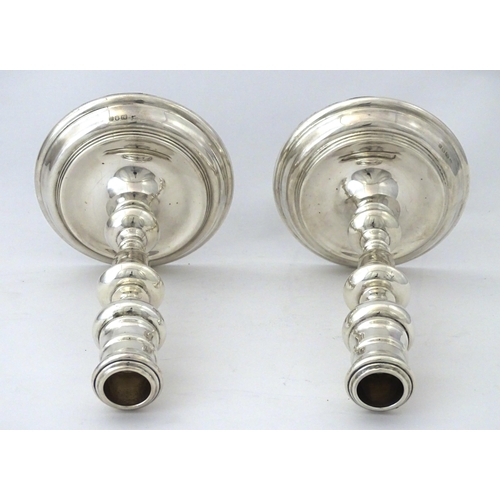 524 - A pair of silver candlesticks hallmarked London 1978, maker John Henry Odell. Approx. 7 1/4