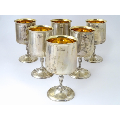 525 - A cased set of six Queen Elizabeth II silver goblets with gilded interiors and textured stems, hallm... 