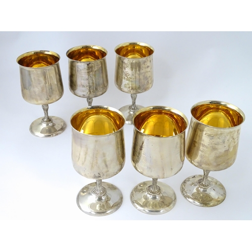 525 - A cased set of six Queen Elizabeth II silver goblets with gilded interiors and textured stems, hallm... 