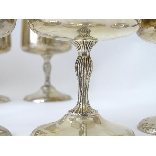 525 - A cased set of six Queen Elizabeth II silver goblets with gilded interiors and textured stems, hallm... 