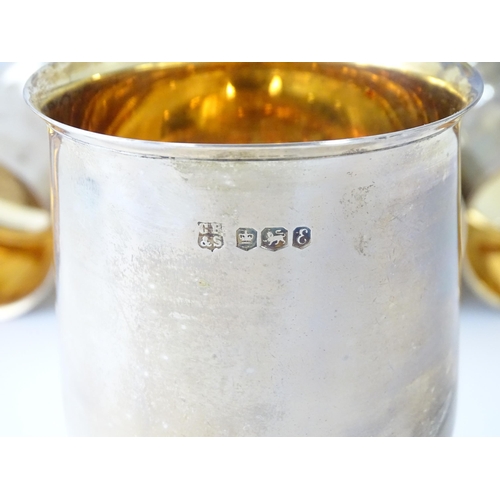 525 - A cased set of six Queen Elizabeth II silver goblets with gilded interiors and textured stems, hallm... 