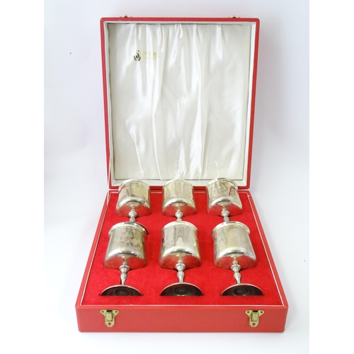 525 - A cased set of six Queen Elizabeth II silver goblets with gilded interiors and textured stems, hallm... 