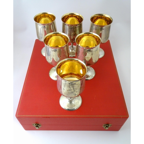 525 - A cased set of six Queen Elizabeth II silver goblets with gilded interiors and textured stems, hallm... 