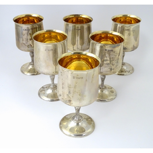 525 - A cased set of six Queen Elizabeth II silver goblets with gilded interiors and textured stems, hallm... 