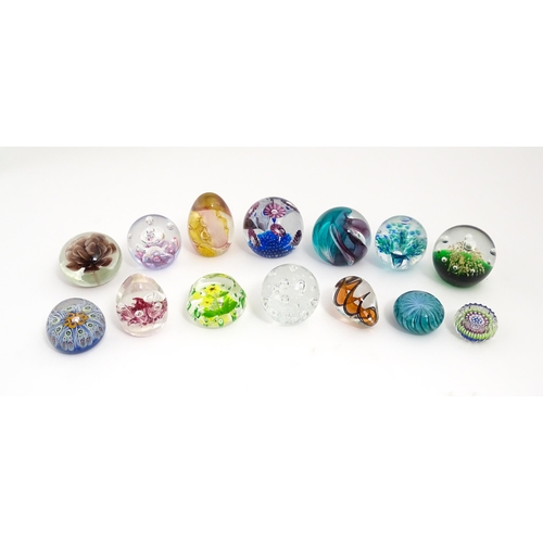 230 - A quantity of glass paperweights to include examples by Murano, Caithness, Selkirk, etc. Largest app... 