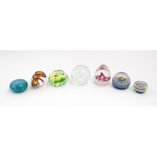 230 - A quantity of glass paperweights to include examples by Murano, Caithness, Selkirk, etc. Largest app... 