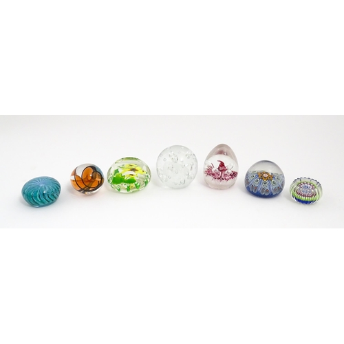 230 - A quantity of glass paperweights to include examples by Murano, Caithness, Selkirk, etc. Largest app... 