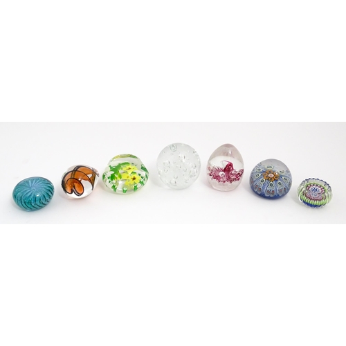 230 - A quantity of glass paperweights to include examples by Murano, Caithness, Selkirk, etc. Largest app... 