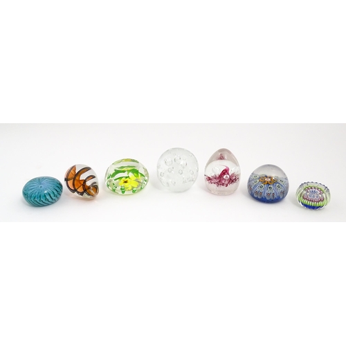 230 - A quantity of glass paperweights to include examples by Murano, Caithness, Selkirk, etc. Largest app... 