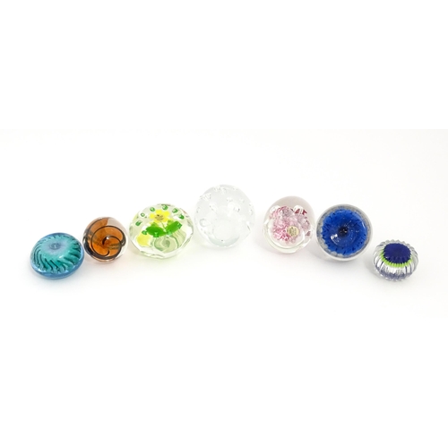 230 - A quantity of glass paperweights to include examples by Murano, Caithness, Selkirk, etc. Largest app... 