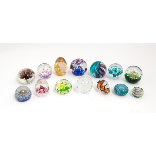 230 - A quantity of glass paperweights to include examples by Murano, Caithness, Selkirk, etc. Largest app... 