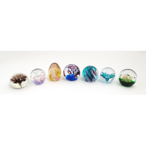 230 - A quantity of glass paperweights to include examples by Murano, Caithness, Selkirk, etc. Largest app... 