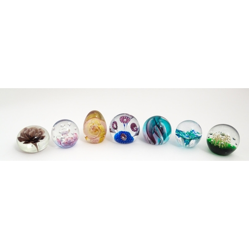 230 - A quantity of glass paperweights to include examples by Murano, Caithness, Selkirk, etc. Largest app... 