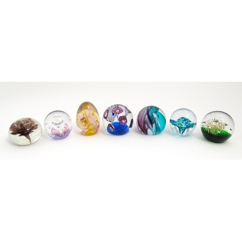 230 - A quantity of glass paperweights to include examples by Murano, Caithness, Selkirk, etc. Largest app... 