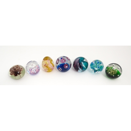 230 - A quantity of glass paperweights to include examples by Murano, Caithness, Selkirk, etc. Largest app... 