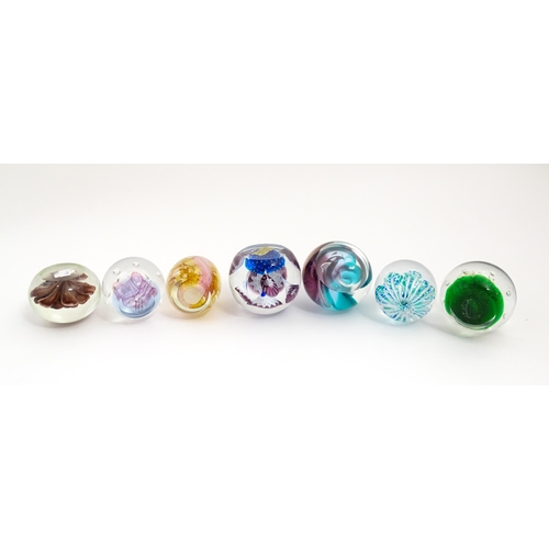 230 - A quantity of glass paperweights to include examples by Murano, Caithness, Selkirk, etc. Largest app... 