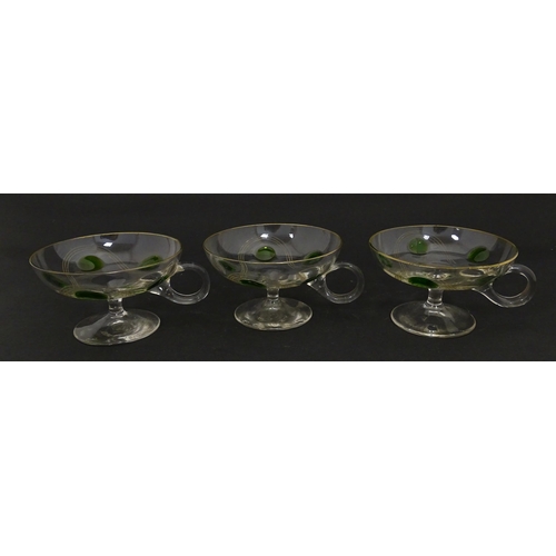 251 - WITHDRAWN FROM AUCTION - A set of six pedestal glasses with champagne coupe style bowls and green de... 