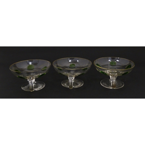 251 - WITHDRAWN FROM AUCTION - A set of six pedestal glasses with champagne coupe style bowls and green de... 