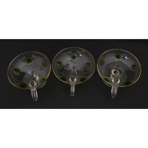 251 - WITHDRAWN FROM AUCTION - A set of six pedestal glasses with champagne coupe style bowls and green de... 