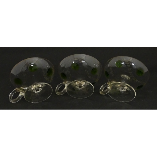 251 - WITHDRAWN FROM AUCTION - A set of six pedestal glasses with champagne coupe style bowls and green de... 