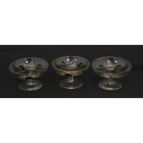 251 - WITHDRAWN FROM AUCTION - A set of six pedestal glasses with champagne coupe style bowls and green de... 