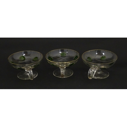 251 - WITHDRAWN FROM AUCTION - A set of six pedestal glasses with champagne coupe style bowls and green de... 