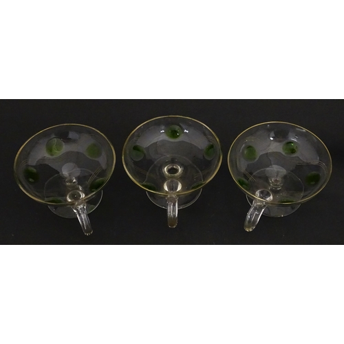 251 - WITHDRAWN FROM AUCTION - A set of six pedestal glasses with champagne coupe style bowls and green de... 