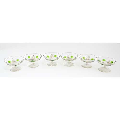 251 - WITHDRAWN FROM AUCTION - A set of six pedestal glasses with champagne coupe style bowls and green de... 