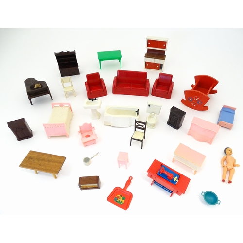 865 - Toys: A quantity of assorted dolls house furniture to include beds, chest of drawers, basin, bath an... 