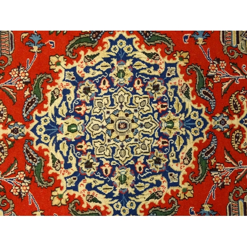 1361 - Carpet / rug : A Central Persian Isfahan rug, the red and blue grounds decorated with various birds,... 