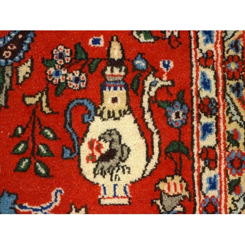 1361 - Carpet / rug : A Central Persian Isfahan rug, the red and blue grounds decorated with various birds,... 