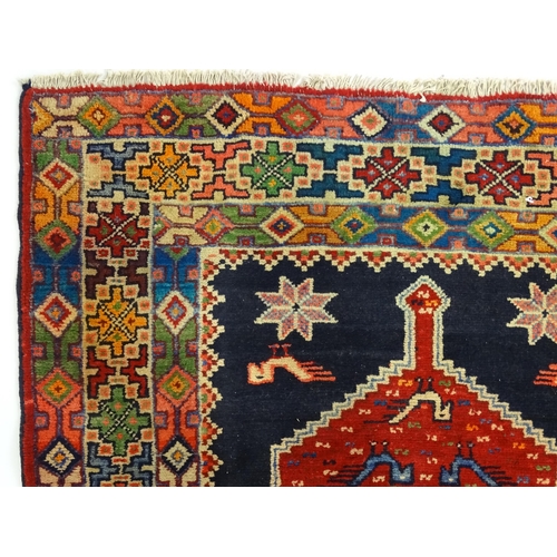 1365 - Carpet / Rug : A North East persian Kurdish Runner. The dark ground decorated with repeating medalli... 