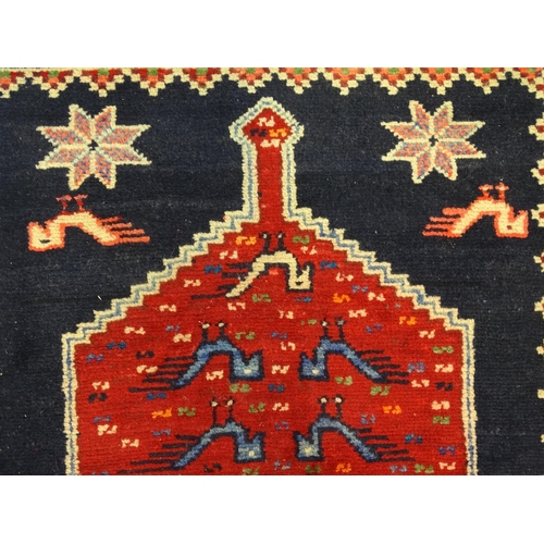 1365 - Carpet / Rug : A North East persian Kurdish Runner. The dark ground decorated with repeating medalli... 