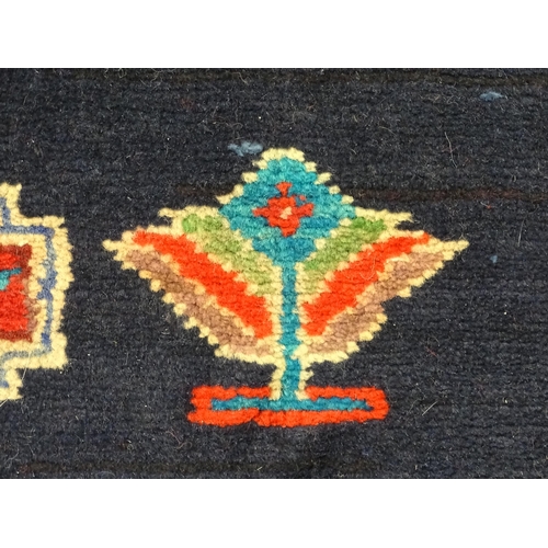 1365 - Carpet / Rug : A North East persian Kurdish Runner. The dark ground decorated with repeating medalli... 