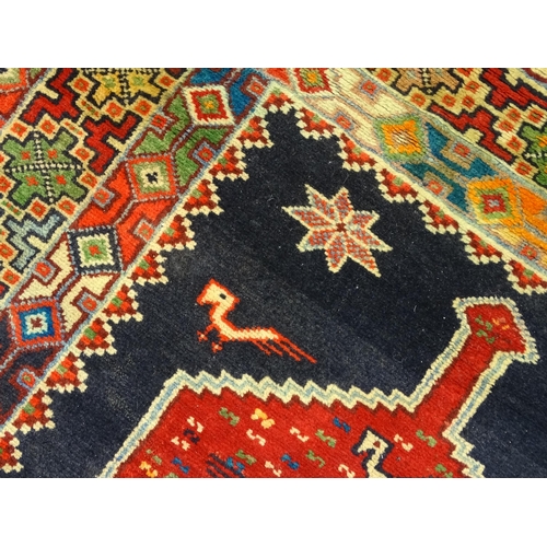 1365 - Carpet / Rug : A North East persian Kurdish Runner. The dark ground decorated with repeating medalli... 