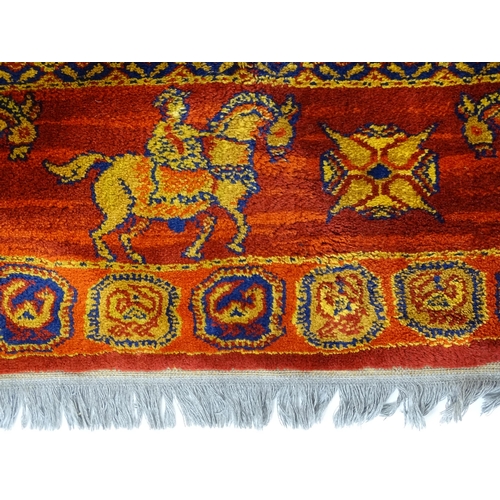 1377 - Carpet / Rug : A Russian rug decorated with horseman in procession and chequerboard geometric centre... 