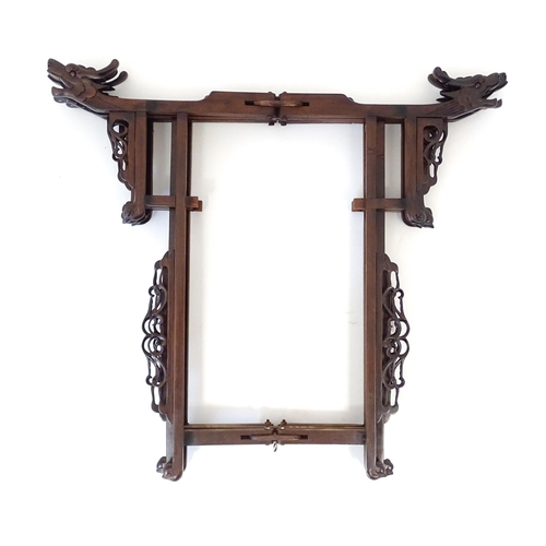 1026 - A Chinese lantern the wooden frame with fretwork and carved dragon detail, with twelve hand painted ... 