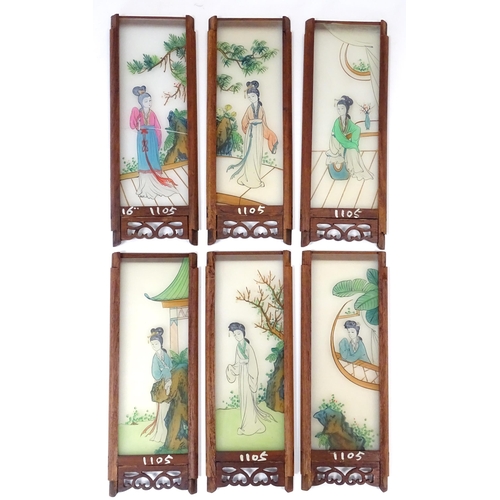 1026 - A Chinese lantern the wooden frame with fretwork and carved dragon detail, with twelve hand painted ... 