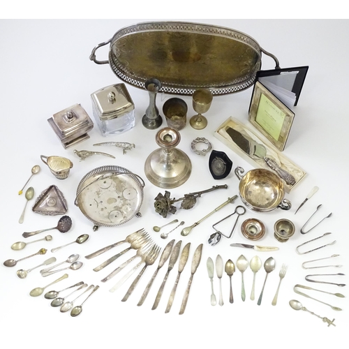 573 - A quantity of silver plate items to include various flatware / cutlery, photograph album, tea caddy,... 