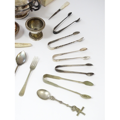 573 - A quantity of silver plate items to include various flatware / cutlery, photograph album, tea caddy,... 