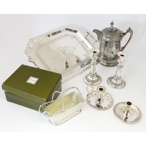 575 - A quantity of silver plate items to include a twin handled tray, pair of candlesticks, chamberstick,... 