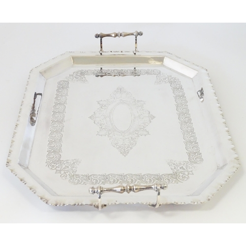 575 - A quantity of silver plate items to include a twin handled tray, pair of candlesticks, chamberstick,... 