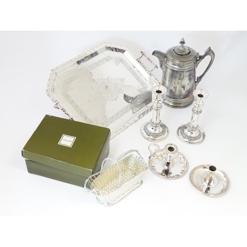 575 - A quantity of silver plate items to include a twin handled tray, pair of candlesticks, chamberstick,... 