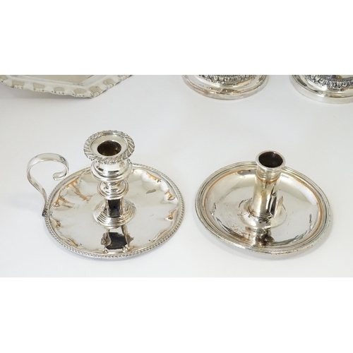 575 - A quantity of silver plate items to include a twin handled tray, pair of candlesticks, chamberstick,... 