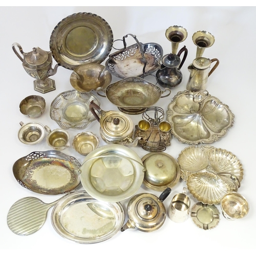 576 - A large quantity of silver plate items to include entree dishes, teapots, cake baskets, hand mirror,... 