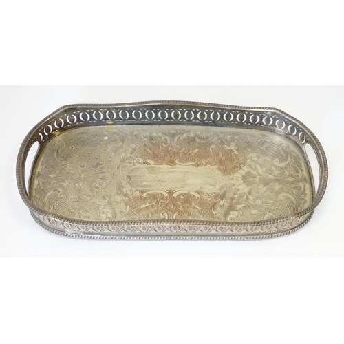 577 - A quantity of silver plated wares to include trays, tea set, bottle coaster, etc.