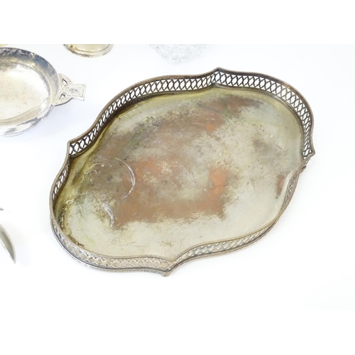 577 - A quantity of silver plated wares to include trays, tea set, bottle coaster, etc.